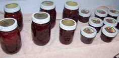 there are many jars of jam on the table