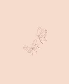 two butterflies flying in the air on a pink background