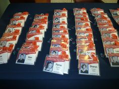 the table is covered with orange and white identification cards for people who have been murdered