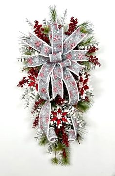 a christmas wreath with snowflakes and red berries