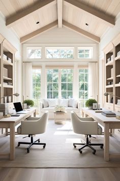 a living room filled with lots of furniture and bookshelves next to a window