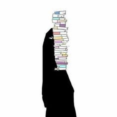 a person holding a stack of books in the air with their hand on top of it