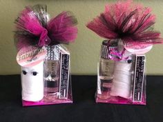 two bottles with pink and white stuff in them