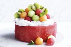 there is a cake with fruit on top