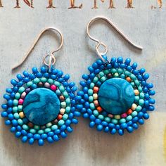 Small Beaded Dainty Blue Jasper Earrings, Handmade Boho Dangle Drop Earrings,  Small seed bead disk earrings made with bright blue enhanced Jasper beads and mullticolored  seed beads. Each tiny bead is individually hand sewn and expertly woven to make these beautiful earrings. The  ear wires and findings are 14kt gold plated.  These small disc earrings measure approximately 2 inches including the ear wires. The Jasper gemstones are 1.25 inches.  Lightweight and fun to wear. Perfect gift for a lo Bohemian Wedding Earrings, Disk Earrings, Earrings Handmade Boho, Blue Beaded Earrings, Blue Jasper, Silver Statement Earrings, Jasper Earrings, Beaded Earrings Patterns, Bead Stitching