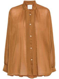 caramel brown cotton-silk blend semi-sheer construction band collar long sleeves buttoned cuffs pleat detailing rear pintuck detailing curved hem front button fastening Classic Brown Blouse For Work, Classic Brown Blouse With Button Closure, Classic Brown Blouse With Button Cuffs, Elegant Brown Button-up Blouse, Elegant Brown Blouse With Buttons, Elegant Brown Tops For Daywear, Classic Brown Blouse For Spring, Classic Brown Tops For Daywear, Classic Brown Spring Blouse