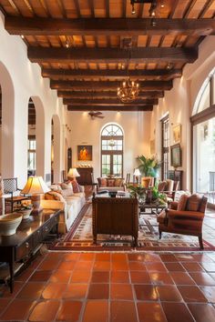 a living room filled with furniture and lots of windows