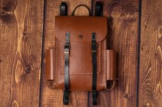 The Explorer is our first-ever leather backpack. Its structured satchel-style design makes it stylish for the workplace yet practical enough to answer the call of adventure. Boasting contrasting colours, adjustable shoulder straps and a double buckle closure, this classic bag will assist you in all your explorations! Size: 27 cm | 40 cm | 8 cm Weight: 1200 g It began in 2009 with a ball of wool and a crocheting needle in a Roma community in North West Romania where the Hungarian plain meets the Vegetable Tanned Leather Backpack With Leather Backing, Leather Adventure Backpack, Adventure Leather Backpack With Leather Handles, Everyday Leather Backpack With Leather Patch, Leather Backpack With Patch For Daily Use, Everyday Leather Patch Backpack, Leather Backpack With Leather Patch For Daily Use, Daily Use Leather Backpack With Leather Patch, Leather Adventure Backpack With Adjustable Strap