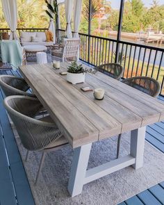 a wooden table sitting on top of a patio