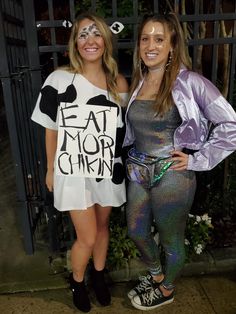 two women standing next to each other wearing costumes