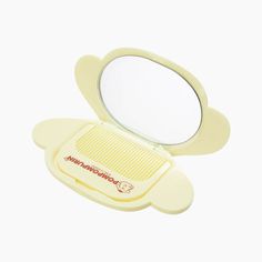 The Compact Mirror and Comb Set by Sanrio features the adorable Pompompurin. Its compact size makes it great for portability. Made with sturdy material but lightweight to carry. Fit in a tote bag, purse, or beauty bag. A beauty set for on-the-go! Size: 12.7 cm x 1.6 cm x 7.7 cm Brand: Sanrio