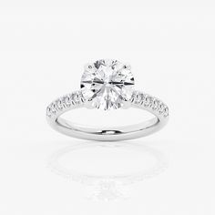 a diamond engagement ring on a white background