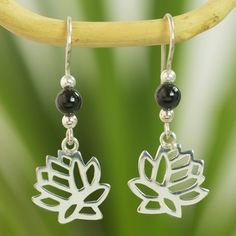 Precious black jade mined in Guatemala crowns sterling lotus blossoms. Dancing on silver hooks the floral silhouettes bring their beauty to Pablo Roquel's handcrafted earrings. .925 Sterling silver Jade Flower, Lotus Earrings, Black Jade, Lotus Blossom, The Lotus, Jade Jewelry, Handcrafted Earrings, Flower Bracelet, Jade Pendant