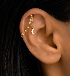 This Helix chain is a chain for earrings. There are different charms available as well as different sizes. The earring chain is sterling silver that is gold plated. This dainty, modern, minimalist-style chain can be worn daily as well as on special occasions. Please note this is a chain and does NOT come with an earring. Gold Chain Cartilage Earrings As A Gift, Gold Dangle Chain Cartilage Earrings, Gold Dangle Cartilage Earrings With Adjustable Chain, Gold Cartilage Earrings With Chain As Gift, Dainty Cartilage Dangle Earrings With Adjustable Chain, Dainty Cartilage Earrings With Adjustable Chain Dangle, Gold Earring Chain, Helix Chain, Cartilage Chain