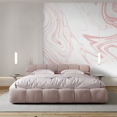 a large bed sitting on top of a wooden floor next to a wall covered in pink paint