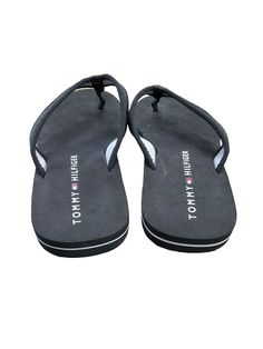 Brand: TOMMY HILFIGER Style: SANDALS FLIP FLOPS Color: BLACK Size: 8.5 SKU: 129-5836-9137 CONDITION: GENTLY USED Black Toe Post Slippers For Vacation, Black Toe Post Slippers For Beach, Black Toe Post Beach Slippers, Casual Black Toe Post Slippers, Black Toe Post Slippers With Cushioned Footbed, Black Toe Post Flip Flops For The Beach, Black Toe Post Casual Slippers, Black Toe Post Flip Flops For Beach, Black Flat Flip Flops For The Beach