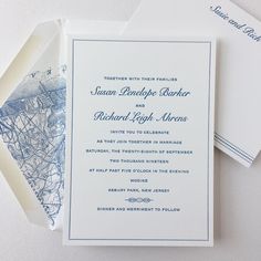 the wedding stationery is laid out on top of each other