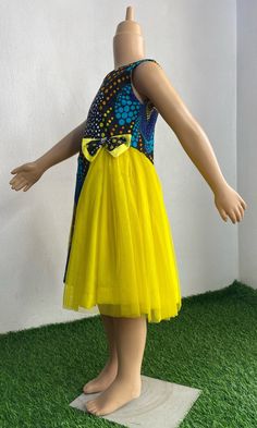 This colorful Princess dress has been made with all the care and love your little one deserves It is custom made to fit perfectly on your little one. It can be requested in other Ankara print of choice. It can be made with extra fullness It is made with 100% cotton Ankara fabric and luxurious tulle Simply start a conversation with me and I will be glad to be of service  Inner soft lining Back zipper sleeveless Yellow Fitted Tulle Dress, Cotton Princess Party Dress, Fitted Tulle Sleeveless Dress For Dress-up, Yellow Tulle Dress For Dress-up Occasions, Fitted Yellow Dress For Dress-up, Yellow Fitted Dress For Dress-up, Whimsical Fitted Tulle Dress, Yellow Tulle Formal Dress, Playful Multicolor Tulle Dresses