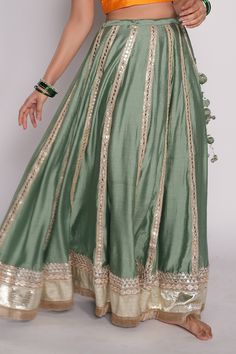 Sea green lehenga in chanderi base with embroidered gota borders.
Component: 1
Pattern: Embroidered
Type Of Work: Gota Work
Fabric: Chanderi
Color: Green
Other Details: 
Attached lining
Gota borders
Fringed hem
Note: The blouse and dupatta worn by the model is not for sale
Occasion: Destination Wedding - Aza Fashions Festive Eid Sets With Long Skirt, Festive Designer Anarkali Set With Long Skirt, Designer Anarkali Set With Zari Work, Anarkali Set With Zari Work Long Skirt, Festive Art Silk Sharara Long Skirt, Designer Traditional Wear Long Skirt For Festive Occasions, Green Palazzo Set With Gota Work For Reception, Festive Anarkali Set With Long Skirt, Diwali Long Skirt Set With Resham Embroidery