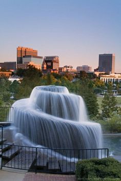 a large waterfall in the middle of a city