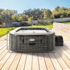 an inflatable hot tub sitting on top of a wooden deck