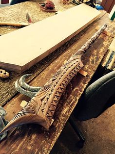 a wooden carving is being worked on in a workshop