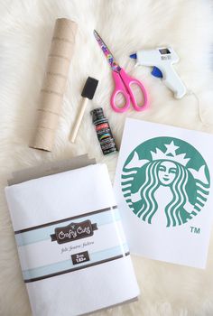 the contents of a starbucks bag laid out on a fur rug