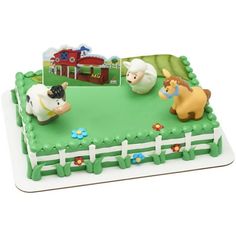 a birthday cake with farm animals on it