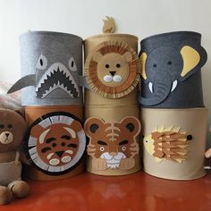 there are many different hats that have animals on them and one is made out of paper