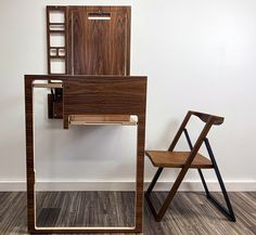 a chair sitting next to a wooden desk