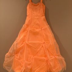 You Will Make A Great Impression In This Gorgeous Orange Beaded Gown By Tiffany. The Bodice Has Beautiful Beadwork And The Cinderella Style Bottom Has Puckered Beading All Around. It’s A Size 14 Youth And Has No Wear Or Tear. Sure To Be The Belle Of The Ball. Beautiful Beadwork, Wear Or Tear, Beaded Gown, Pageant Dress, Bead Work, Cinderella, Bodice, Beading, Prom Dresses