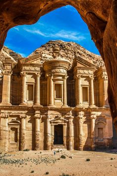 an arch in the side of a large building