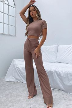 This two piece casual set offers comfort and style. Perfect for your lounge feeling days. Features: Basic style Number of pieces: Two-piece Stretch: Slightly stretchy Material composition: 95% polyester, 5% spandex INCH Size S M L XL US 4 6/8 10/12 14 Top Length 14.6 15 15.4 15.7 Sleeve Length 9.1 9.4 9.8 10.2 Bust 27.6 29.1 31.5 33.9 Bottom Length 39.8 40.2 40.6 40.9 Waist 24.4 26 28.3 30.7 HIP - *This data was obtained from manually measuring the product, it may be off by 0.4 ~ 1.2 inch. Little White Crop With Pants, Solid Color Short Sleeve Lounging Sets, Solid Color Short Sleeve Loungewear Sets, Stretchy Two-piece Set With Short Sleeves, Stretch Two-piece Set With Short Sleeves, Casual Loungewear Two-piece Pants Set, Casual Solid Color Matching Pant Set, Solid Color Stretch Leisure Set, Solid Color Stretch Sets For Leisure