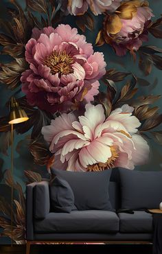 a living room with floral wallpaper on the walls and a couch in front of it