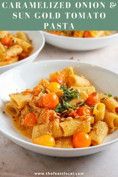 two white bowls filled with pasta and vegetables