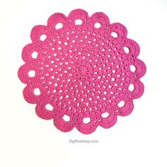 pink crocheted doily on white background