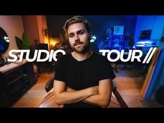 a man with his arms crossed sitting in front of a laptop computer and the words studio tour above him