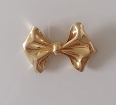 "Magnificent vintage CHRISTIAN DIOR bow in gold metal Signed on plate :     Ch Dior - Germany 8cm X 5.5cm   3.9\" X 2\" In excellent vintage condition" Vintage Christian Dior, Vintage Dior, Christian Dior, Metal Signs, Brooches, Gold Metal, Knot, Dior, Germany