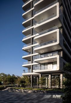 an apartment building with balconies on the top floor