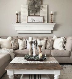 a living room filled with furniture and decor on top of a rug covered carpeted floor