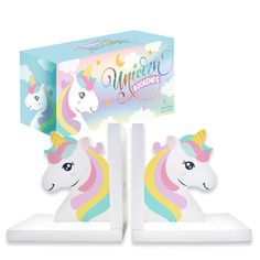 the unicorn bookends are in front of a box