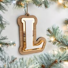 a wooden ornament hanging from a christmas tree