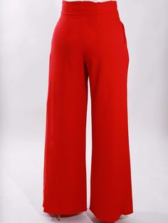 Being bold is the standard when you wear these fire palazzo pants. This piece embodies a fit and flare style that will turn heads immediately. Add definition to your outfit in an instant! High waisted, long pants with wide legs. Pockets are hidden in the side seams. These pants will make an elegant look with a silk blouse or bodysuit. Pair with our black bodysuit! Color: Red Inseam: 32" Hidden front zipper Made in USA 95% Rayon / 5% Spandex Available for pick up and is shipped out within 3 busin Chic Red Full Length Wide Leg Pants, Chic Red Wide Leg Full Length Pants, Elegant Red Flare Bottoms, Chic Red Wide Leg Bottoms, Chic Red Flared Bottoms, Bold Wide Leg Bottoms, Elegant Red Stretch Wide Leg Pants, Red Stretch Wide Leg Full-length Pants, Stretch Wide Leg Red Pants For Workwear