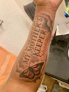 a person with a tattoo on their arm that says, my mothers are the butterflies