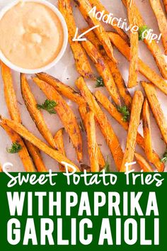 sweet potato fries with paprika garlic aioli on a white plate and green background