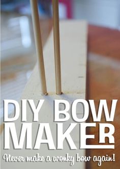 the words diy bow maker are written in white on a wood block with sticks sticking out of it