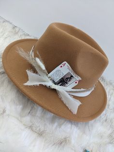 Cowboy Playing card to add to your hat band for a custom hat.  Want to customize your favorite hat? Add a Hat band, Pin and Cowboy playing card for a custom look.  Update your favorite western hat.  The possibilities for a custom hat are endless!  * Card Options:   A, 2,3,4 - These are "Life on the Range" Series     A- Describes the Roundup, 2-Cattle Drive, 3-Branding, 4-The art of roping 5,6,7 - These are "famous Cowboys and Cowgirls"      5-Roy Rogers and Dale Evans, 6-Nate Love, 7-Theodore Roosevelt 8,9,10 - These are "Cowboy History Series"     8-African American/ Native American Cowboy, 9-Modern Rodeos, 10-Famous Cattle Trails J,Q,K - These are "Cowboy Gear and Equipment" Series     J-Chuck Wagon, Q-The Covered Wagon, K-Fire Arms *Boho Feather with matchsticks- stick this in your hat Brown Flat Bill Hat Bands For Kentucky Derby, Western Fedora Mini Hats For Western-themed Events, Western Brown Mini Fedora Hat, Brown Fedora Mini Hat For Kentucky Derby, Felt Hat For Kentucky Derby And Western-themed Events, Famous Cowboys, The Range, Endless Card, Cowboy History