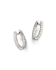 Classic diamond inside-out hoop earrings dazzle in 14K white gold. Classic Diamond White Huggie Earrings With Pave Setting, Classic Huggie Earrings With Round Cut Pave Setting, Formal White Gold Huggie Earrings With Halo Design, Classic Diamond White Brilliant Cut Huggie Earrings, Classic Diamond White Huggie Earrings With Brilliant Cut, Classic Brilliant Cut Diamond White Huggie Earrings, Classic Diamond Hoop Earrings With Single Cut Diamonds, Classic Platinum Hoop Earrings In White Gold, Classic Round Cut Hoop Earrings With Single Cut Diamonds