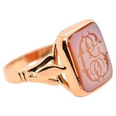 Discover the timeless elegance of this 18-carat gold ring, certified by a French "poinçon de maître", guaranteeing exceptional gold quality at 750 thousandths. This unique piece is adorned with a magnificent rectangular agate plaque, subtly engraved with the letters "C" and "S". Weighing 6.4 grams, this ring is distinguished by its generous dimensions, with an agate plaque measuring 2.1 cm in height and 1.4 cm in width, offering an imposing yet refined presence on your finger. Designed for a siz Luxury Rectangular Diamond Anniversary Ring, Luxury Diamond Ring With Rectangular Stone For Anniversary, Elegant Gemstone Signet Ring For Formal Occasions, Classic Formal Signet Ring With Gemstone, Classic Formal Gemstone Signet Ring, Luxury Gold Cushion Cut Rings, Antique Rings With Polished Finish For Formal Occasions, Antique Rings With Polished Finish For Formal Events, Heirloom Intaglio Signet Ring For Formal Events