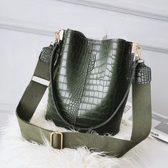 Texture: PUBag shape: bucket shapeColor: black, coffee, green Upper width Lower width height thickness Shoulder strap 26 24 28 16 120 Unit: cm Wool Tote Bag, Kavu Rope Bag, Tas Bahu, Soft Leather Tote, Waterproof Tote, Real Leather Bags, Bucket Handbags, Pu Leather Bag, Rope Bag